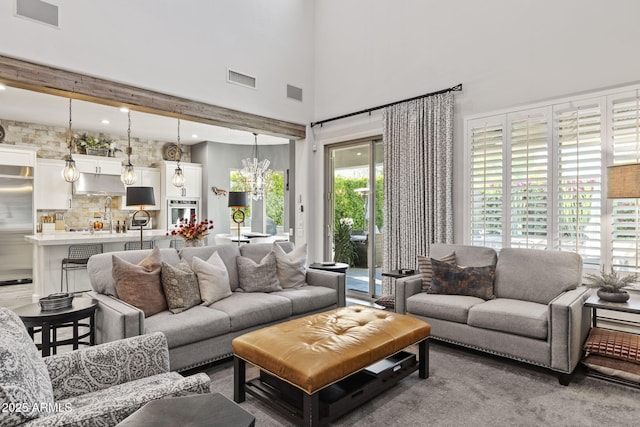 3770 E Ringtail Way, Phoenix, AZ 85050 - carpeted living area featuring a high ceiling and a chandelier