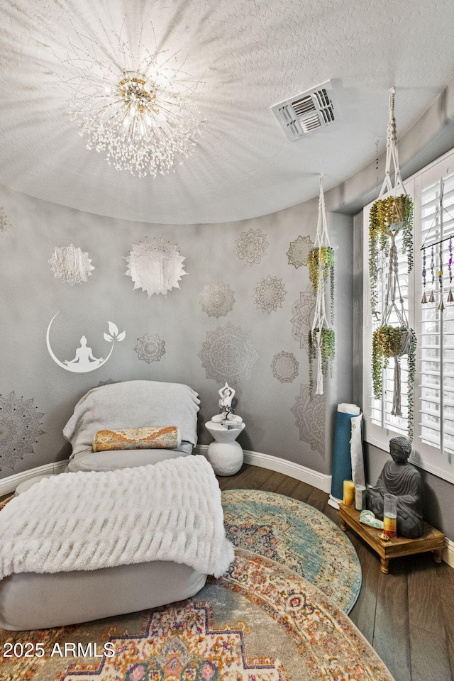 3770 E Ringtail Way, Phoenix, AZ 85050 - bedroom with wood finished floors and a chandelier