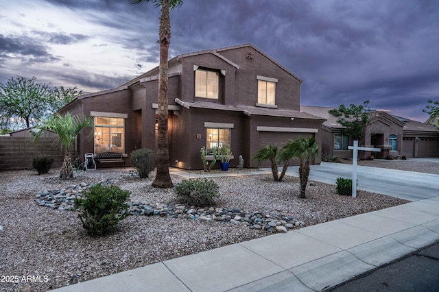 3488 N Lady Lake Ln, Casa Grande, AZ 85122 - traditional-style home featuring driveway, an attached garage, stucco siding, and fence