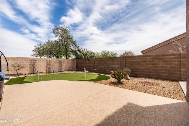 3488 N Lady Lake Ln, Casa Grande, AZ 85122 - view of patio with a putting green and a fenced backyard