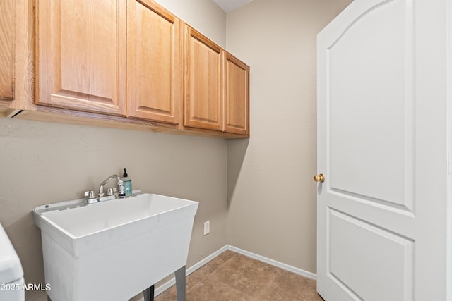 3488 N Lady Lake Ln, Casa Grande, AZ 85122 - laundry area with cabinet space and baseboards