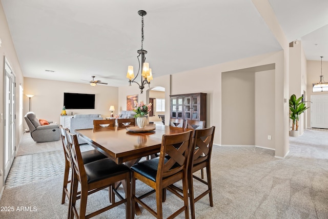 3488 N Lady Lake Ln, Casa Grande, AZ 85122 - dining area with light carpet, plenty of natural light, ceiling fan, and a chandelier