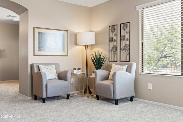 3488 N Lady Lake Ln, Casa Grande, AZ 85122 - living area featuring carpet flooring, arched walkways, and baseboards