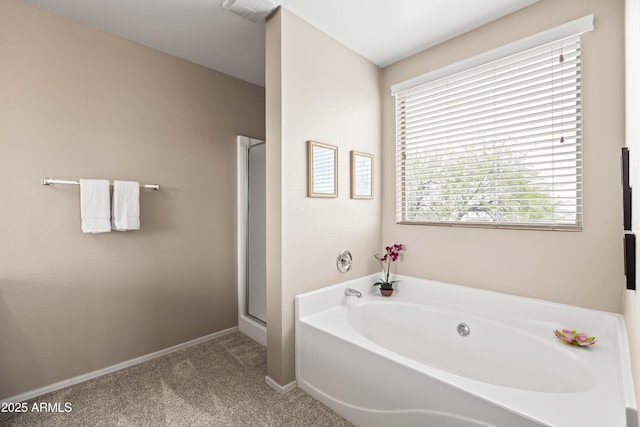 3488 N Lady Lake Ln, Casa Grande, AZ 85122 - bathroom with a bath, a stall shower, and baseboards