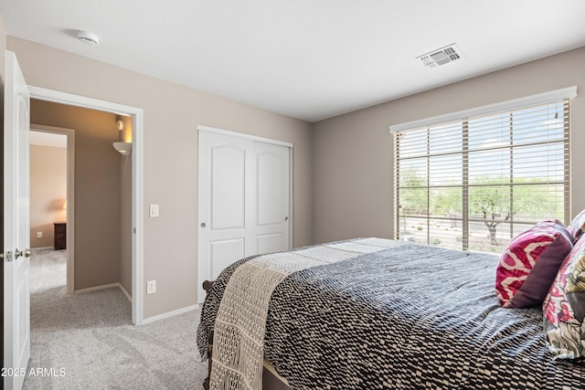 3488 N Lady Lake Ln, Casa Grande, AZ 85122 - bedroom with light carpet, a closet, and baseboards