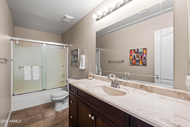 3488 N Lady Lake Ln, Casa Grande, AZ 85122 - full bathroom featuring toilet, vanity, combined bath / shower with glass door, and tile patterned floors
