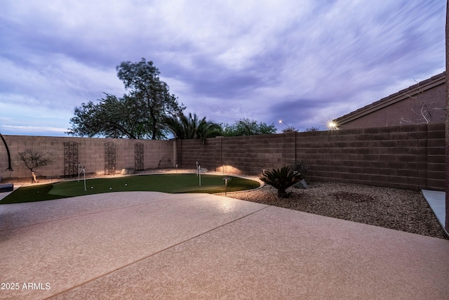 3488 N Lady Lake Ln, Casa Grande, AZ 85122 - view of patio / terrace with an area to practice putting and a fenced backyard