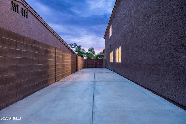 3488 N Lady Lake Ln, Casa Grande, AZ 85122 - patio terrace at dusk with a fenced backyard