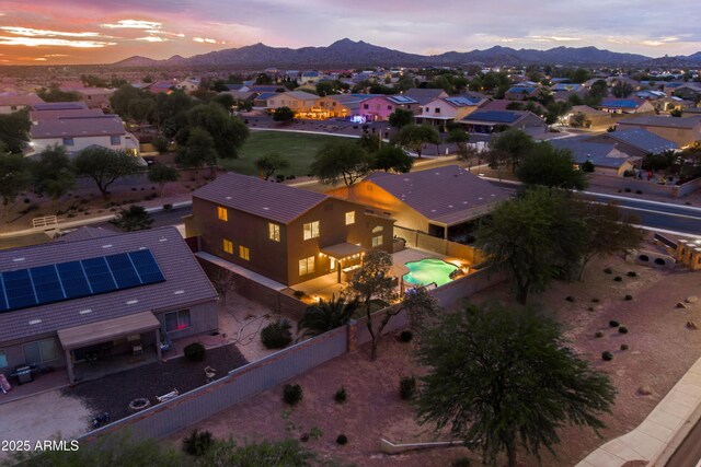 3488 N Lady Lake Ln, Casa Grande, AZ 85122 - aerial view at dusk of a mountain view and a residential view