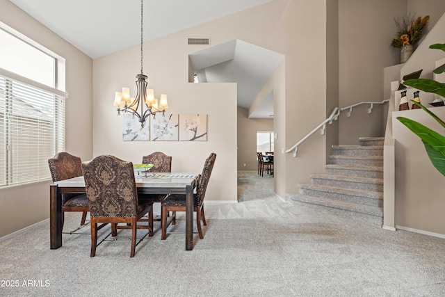 3488 N Lady Lake Ln, Casa Grande, AZ 85122 - carpeted dining space with a chandelier, stairway, baseboards, and high vaulted ceiling