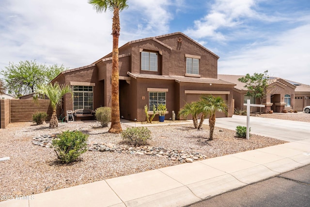 3488 N Lady Lake Ln, Casa Grande, AZ 85122 - traditional-style house featuring fence, concrete driveway, stucco siding, and an attached garage