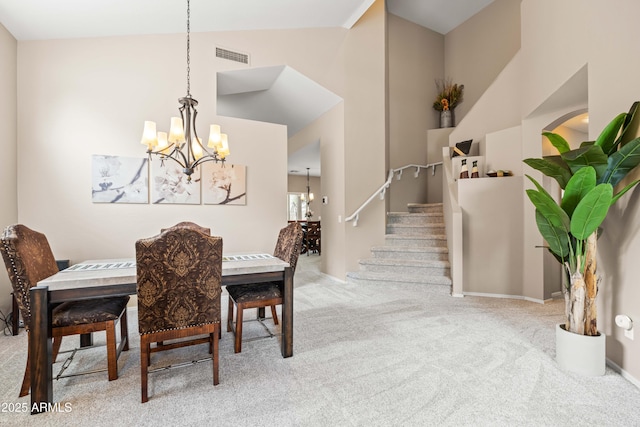 3488 N Lady Lake Ln, Casa Grande, AZ 85122 - carpeted dining room with a chandelier, high vaulted ceiling, stairs, and baseboards