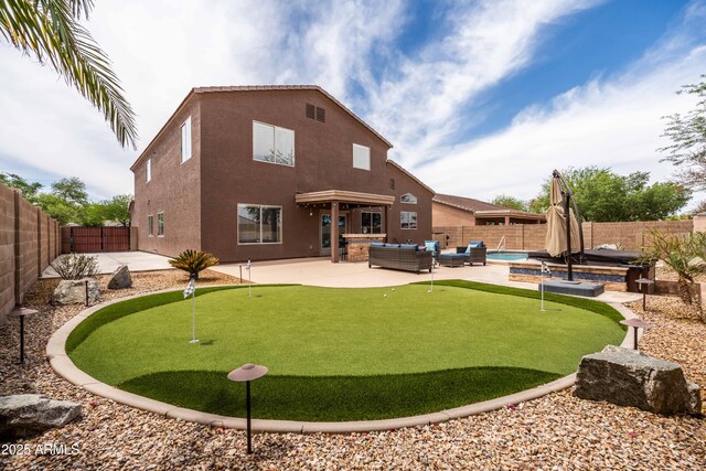3488 N Lady Lake Ln, Casa Grande, AZ 85122 - rear view of property featuring a putting green, outdoor lounge area, and a patio area