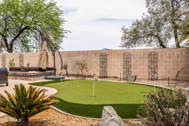 3488 N Lady Lake Ln, Casa Grande, AZ 85122 - view of community with a putting area and a fenced backyard