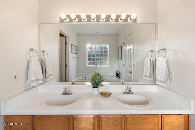 bathroom with a bathing tub and vanity