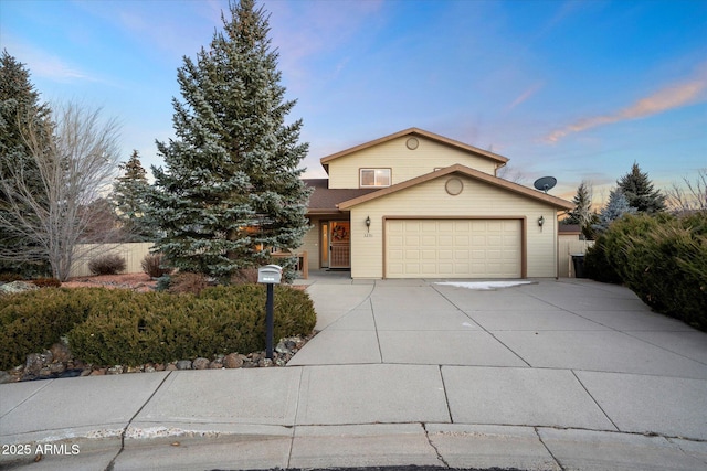 front of property with a garage