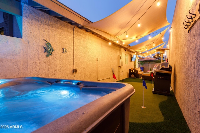 view of swimming pool with a hot tub and an outdoor living space