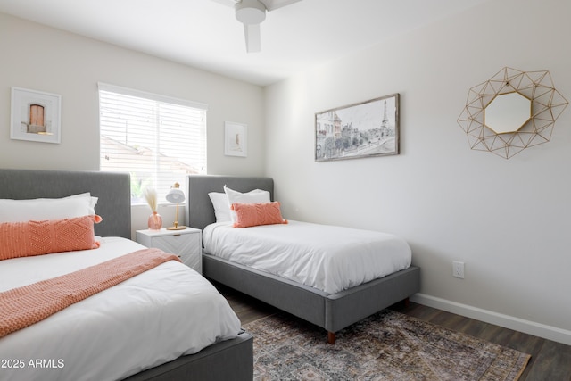 bedroom with ceiling fan and dark hardwood / wood-style floors