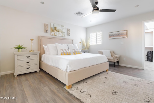 bedroom with ceiling fan and wood-type flooring