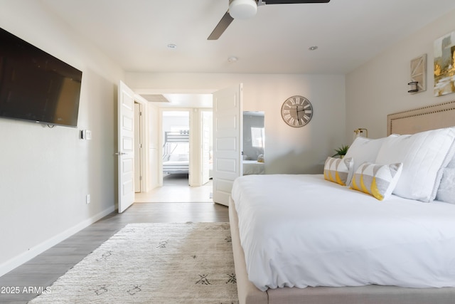 bedroom featuring ceiling fan and hardwood / wood-style flooring