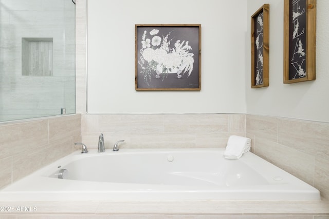 bathroom featuring tiled bath