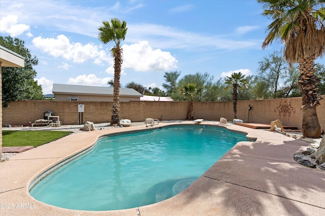 view of pool featuring a patio, a fenced backyard, and a fenced in pool