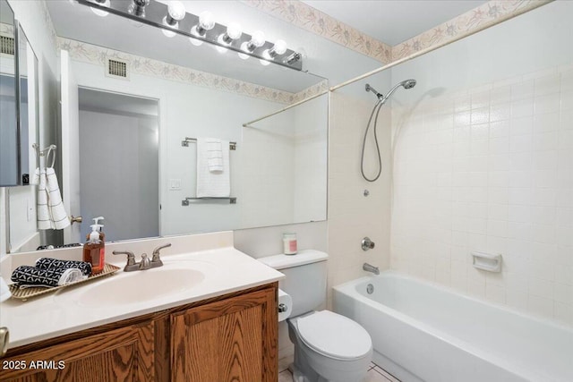 bathroom featuring visible vents, bathing tub / shower combination, toilet, and vanity