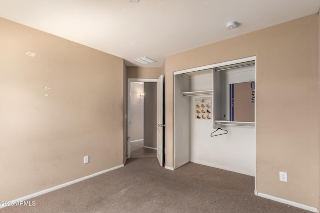 23613 W Mobile Ln, Buckeye, AZ 85326 - unfurnished bedroom featuring carpet floors, a closet, and baseboards