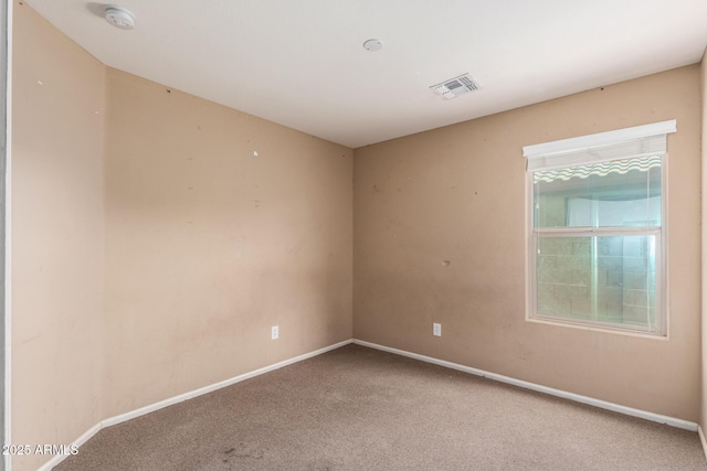 23613 W Mobile Ln, Buckeye, AZ 85326 - carpeted spare room featuring a smoke detector and baseboards