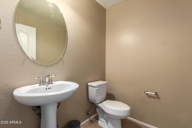 23613 W Mobile Ln, Buckeye, AZ 85326 - half bath with toilet, tile patterned flooring, and baseboards