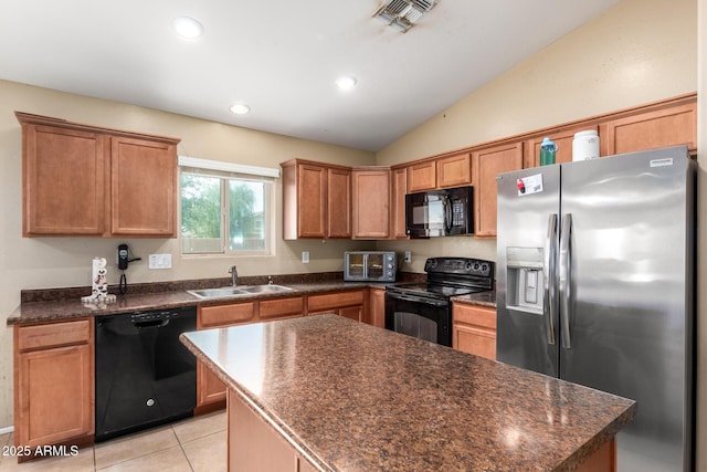 23613 W Mobile Ln, Buckeye, AZ 85326 - kitchen with black appliances, a sink, dark countertops, lofted ceiling, and recessed lighting