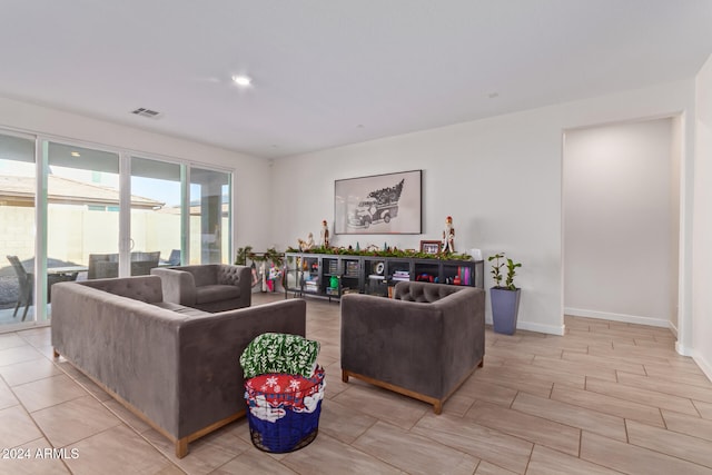 living room with light hardwood / wood-style flooring