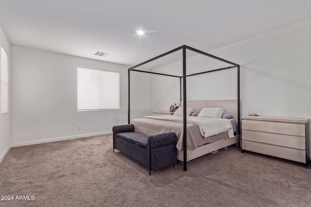 bedroom with dark carpet