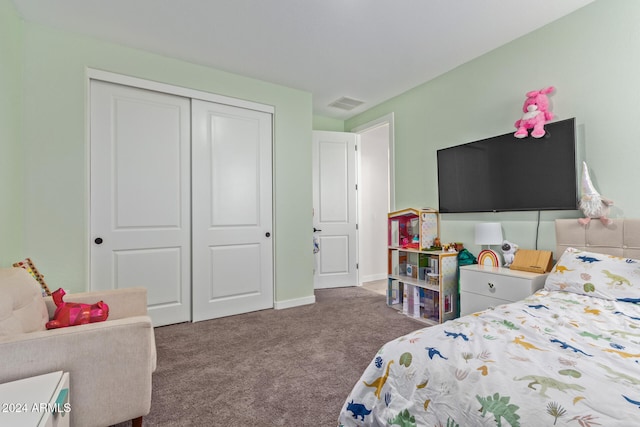 carpeted bedroom featuring a closet