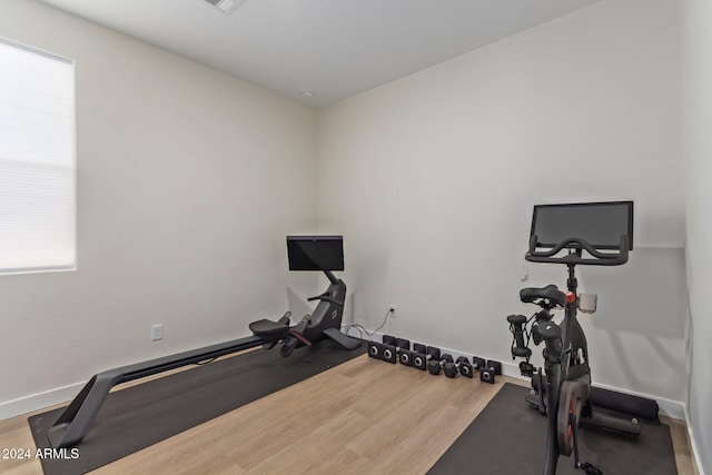 exercise area featuring hardwood / wood-style flooring