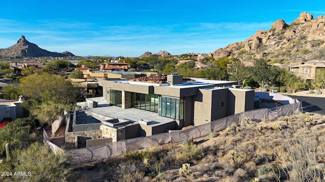 back of house featuring a mountain view