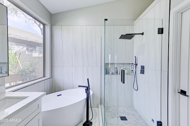 full bathroom featuring a soaking tub, a shower stall, tile walls, and vanity