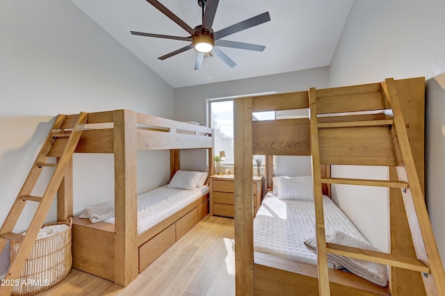 bedroom with lofted ceiling, light wood-style floors, and ceiling fan