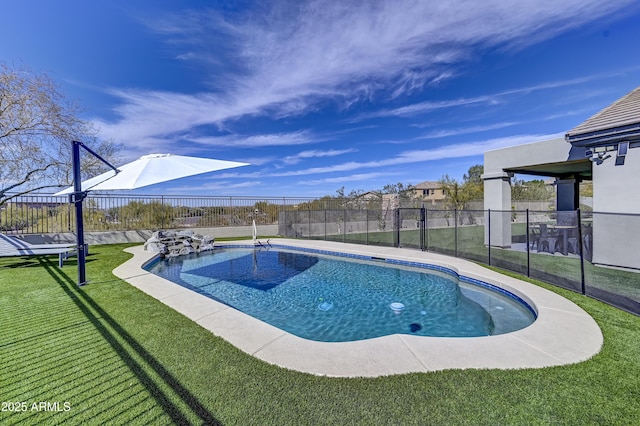 view of pool with a lawn, a fenced backyard, and a fenced in pool