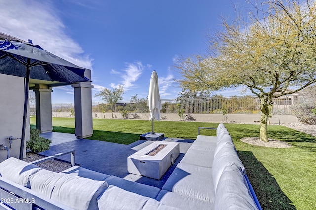 view of patio featuring an outdoor living space with a fire pit and fence