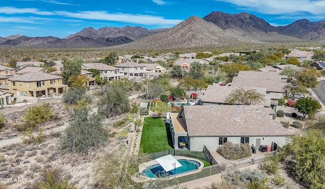 drone / aerial view featuring a residential view and a mountain view