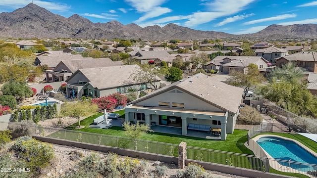 birds eye view of property with a residential view and a mountain view