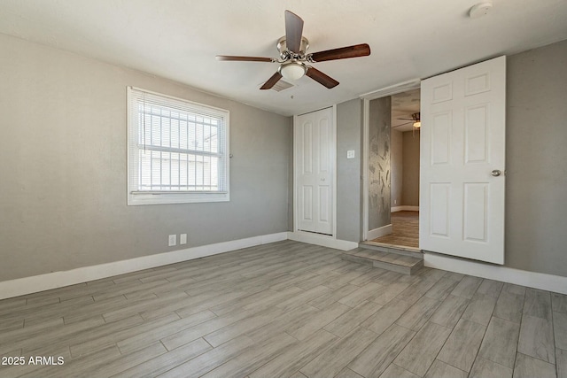 unfurnished bedroom featuring ceiling fan, light hardwood / wood-style floors, and a closet