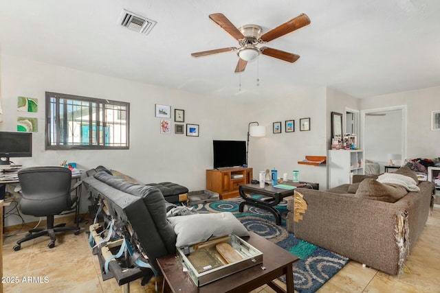 tiled living room featuring ceiling fan