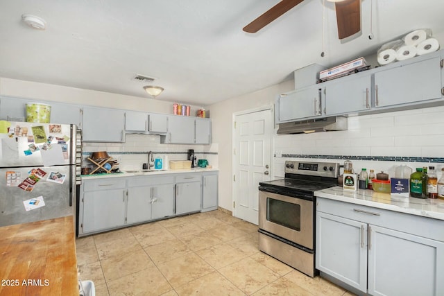 kitchen with ceiling fan, sink, gray cabinets, and stainless steel appliances