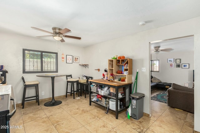 interior space featuring ceiling fan