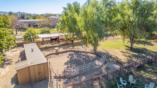 birds eye view of property with a mountain view