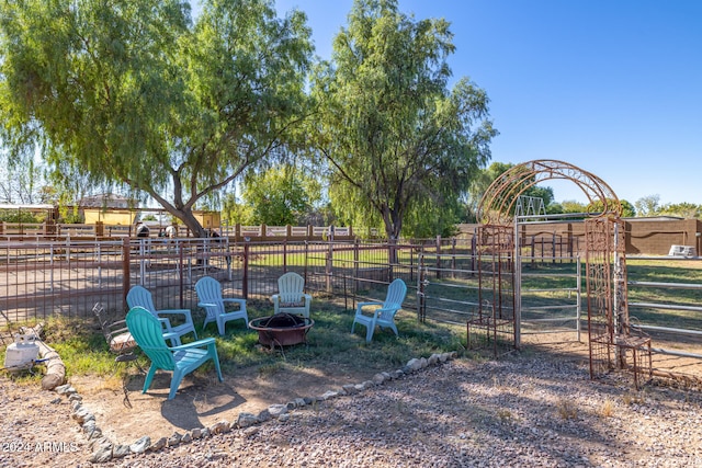 view of yard with a fire pit