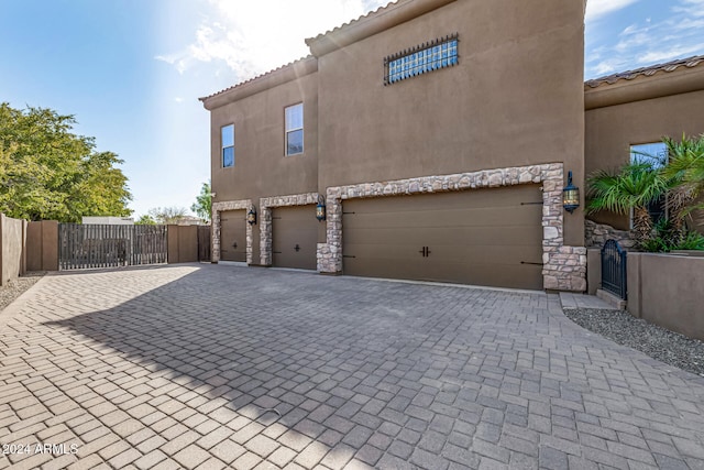 view of side of property featuring a garage