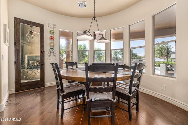 dining area with dark hardwood / wood-style flooring